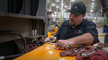 Trained Forklift Mechanic working on a customer forklift