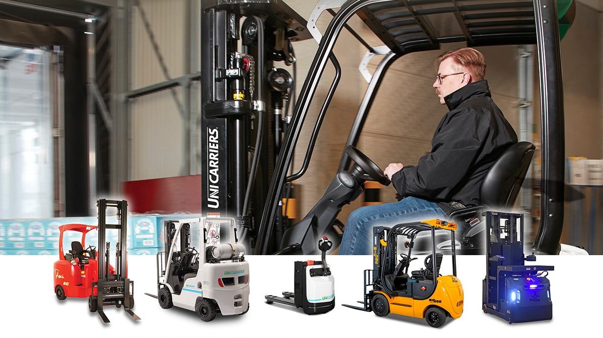 [Driver on UniCarriers Forklift in a warehouse above. Flexi Narrow Aisle Forklift, UniCarriers Nomad LPG Truck, UniCarrers WLX Pallet Truck, Big Joe LXE Electric Forklift, Big Joe Joey Task Vehicle]