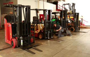 Trained Forklift Mechanic working on a customer forklift